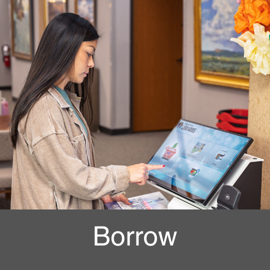 woman using a self-checkout machine